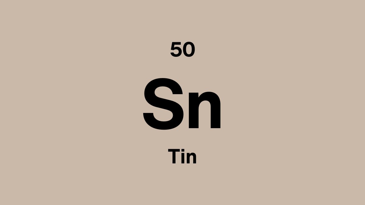 Tin element symbol Sn, atomic number 50, on a sand periodic table tile